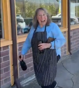 Smiley Jilly about to uncork a bottle